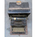 CASED VINTAGE MONARCH VISIBLE TYPEWRITER PLUS ANOTHER TYPEWRITER