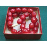 STRAND OF CHERRY AMBER BEADS