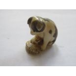 SMALL ANTIQUE ORIENTAL IVORY CARVING DEPICTING A DOG