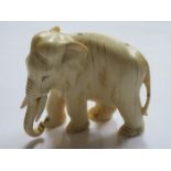 CARVED ANTIQUE AFRICAN/INDONESIAN STYLE IVORY ELEPHANT (AT FAULT)