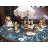 HUMMEL CERAMIC TABLE LAMP AND SIX HUMMEL FIGURES (SOME AT FAULT)