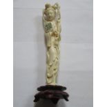 CARVED ANTIQUE ORIENTAL IVORY GEISHA ON WOODEN STAND,