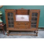 CARVED FRONTED OAK GLAZED TWO DOOR SIDE BY SIDE BUREAU