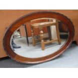 MAHOGANY OVAL BEVELLED WALL MIRROR