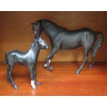 TWO BESWICK GLAZED BLACK HORSES