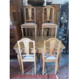 CARVED OAK DINING TABLE AND SIX CHAIRS