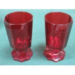 PAIR OF EARLY VICTORIAN RUBY COLOURED OCTAGONAL STEMMED GLASSES (AT FAULT),