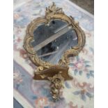HEAVILY GILDED VICTORIAN SHAPED WALL MIRROR (AT FAULT)