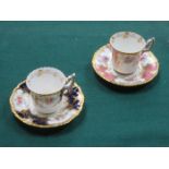 TWO SIMILAR PRETTY GILDED COALPORT COFFEE CUPS AND SAUCERS