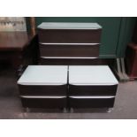 MODERN GLASS TOPPED MELAMINE FOUR DRAWER FILING CHEST AND PAIR OF MATCHING BEDSIDE CHESTS