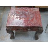 HEAVILY CARVED HARDWOOD OCCASIONAL TABLE HIGHLY DECORATED IN THE ORIENTAL MANNER