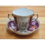 19th CENTURY CONTINENTAL TWO HANDLED CERAMIC CHOCOLATE CUP AND SAUCER,