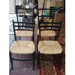 FOUR EBONISED AND RUSH SEATED CHAIRS