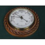 OAK CASED CIRCULAR ANEROID BAROMETER BY D McGREGOR & CO