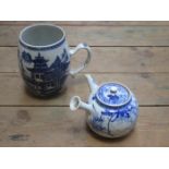 ORIENTAL BLUE AND WHITE TANKARD (AT FAULT) AND BLUE AND WHITE TEAPOT