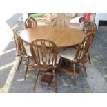 ADAM BEDE OAK CIRCULAR DINING TABLE AND SIX CHAIRS