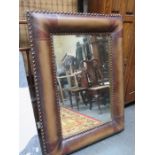 LARGE DECORATIVE BEVELLED WALL MIRROR WITH BROWN LEATHER EFFECT FRAME