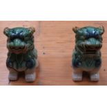 PAIR OF ORIENTAL STYLE GLAZED MYTHICAL DOGS