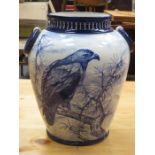 DECORATIVE CERAMIC BLUE AND WHITE VASE DEPICTING A BIRD OF PREY,