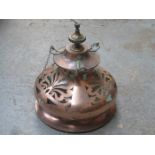 AT NOUVEAU PIERCE WORK DECORATED COPPER AND BRASS CEILING LIGHT FITTING WITH GLASS SHADE,