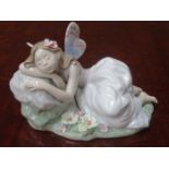 LLADRO PRIVILEGE GLAZED CERAMIC FIGURE OF A RECLINING FAIRY,