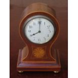 MAHOGANY INLAID MANTLE CLOCK ON RAISED BRASS SUPPORTS AND WITH CIRCULAR ENAMELLED DIAL,