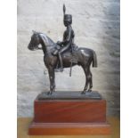 BRONZE EFFECT FIGURE OF A MILITARY GENT ON HORSEBACK, MOUNTED ON WOODEN PLINTH,