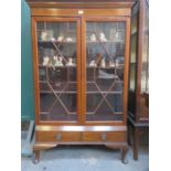 TWO DOOR GLAZED AND MAHOGANY DISPLAY CABINET FITTED WITH TWO DRAWERS BELOW