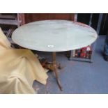 ONYX TOPPED CIRCULAR TABLE ON GILT TRIPOD SUPPORTS