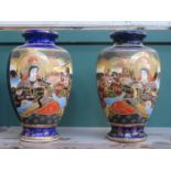 PAIR OF HEAVILY GILDED JAPANESE CERAMIC VASES SET WITH VARIOUS ORIENTAL FIGURES,