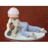 LLADRO COLLECTORS SOCIETY GLAZED CERAMIC FIGURE OF A YOUNG BOY PLAYING WITH A MODEL TRAIN,