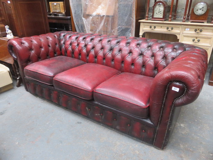 OX BLOOD RED UPHOLSTERED LEATHER THREE SEATER SETTEE