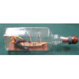 DECORATIVE MODEL OF A SHIP IN A BOTTLE WITH INFORMATION ON THE UNDERSIDE