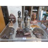 MIXED LOT OF VARIOUS TRIBAL STYLE CARVINGS INCLUDING 'TRINIDAD' CARVED NUT CASING, WALL MASKS,