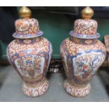 PAIR OF LARGE IMARI STYLE GILDED STORAGE POTS WITH COVERS ON STANDS