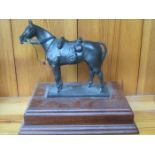 BRONZE COLOURED FIGURE OF A HORSE, MOUNTED ON WOODEN PLINTH, BY PETER HICKS,