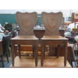 PAIR OF ANTIQUE OAK SHIELD BACK HALL CHAIRS
