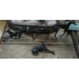 FOUR BRONZE COLOURED METAL GREYHOUND FIGURES