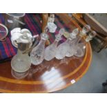 FIVE VARIOUS GLASS DECANTERS AND GLASS CLARET JUG