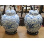 PAIR OF BLUE AND WHITE HANDPAINTED AND GLAZED CERAMIC TABLE LAMPS ON STANDS,