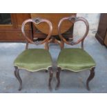 PAIR OF CARVED WALNUT UPHOLSTERED CROWN BACK CHAIRS