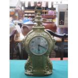 REPOUSSE DECORATED FRENCH STYLE GILT MANTLE CLOCK WITH CIRCULAR DIAL