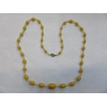 STRAND OF AMBER BEADS