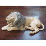 ROYAL COPENHAGEN LARGE GLAZED CERAMIC FIGURE OF A RECUMBENT LION BY LAURITZ JENSON