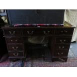 20th CENTURY MAHOGANY NINE DRAWER LEATHER TOPPED WRITING DESK