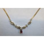 14ct GOLD NECKLACE SET WITH RUBY COLOURED STONE AND CLEAR STONES