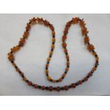 STRAND OF AMBER BEADS