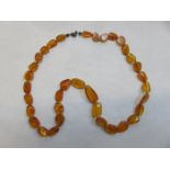 STRAND OF AMBER BEADS