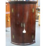 18th CENTURY MAHOGANY BOW FRONTED WALL MOUNTING CORNER CUPBOARD