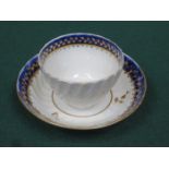 EARLY GILDED AND WAVE EDGED CERAMIC TEA BOWL AND SAUCER
